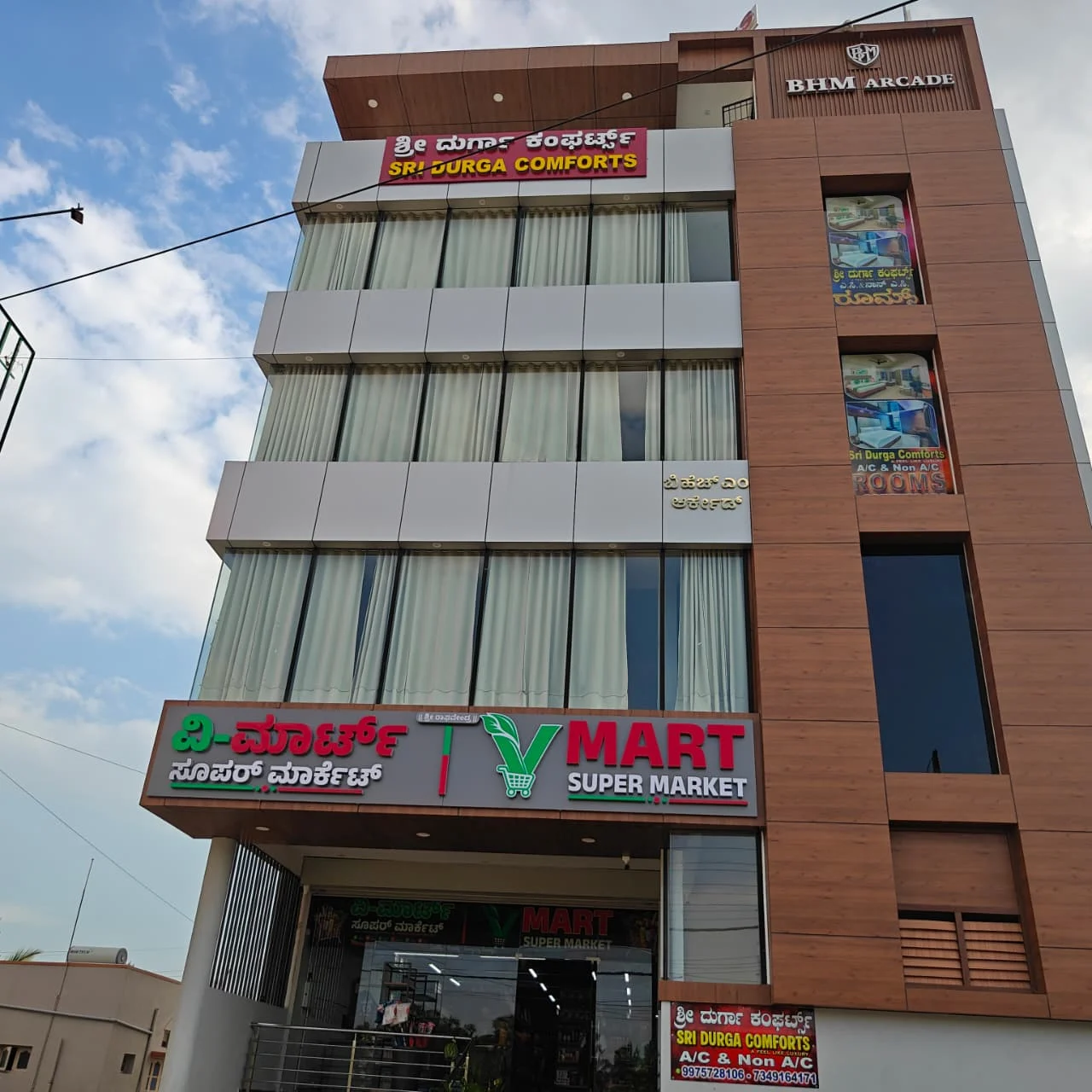 Sri Durga Comforts building at BHM Arcade, Bellur Cross, with direct access from NH-75